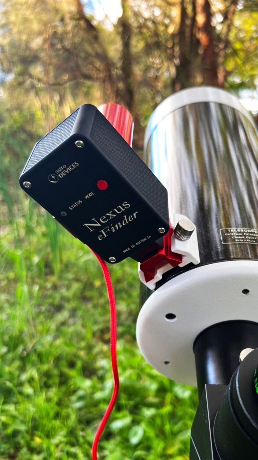 A close-up of the black Nexus eFinder mounted on a scope