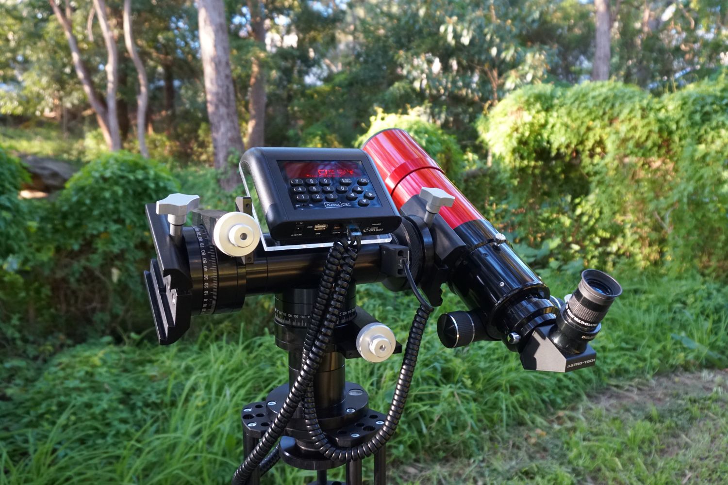 A Nexus DSC on a dual mount with a red telescope on the right side