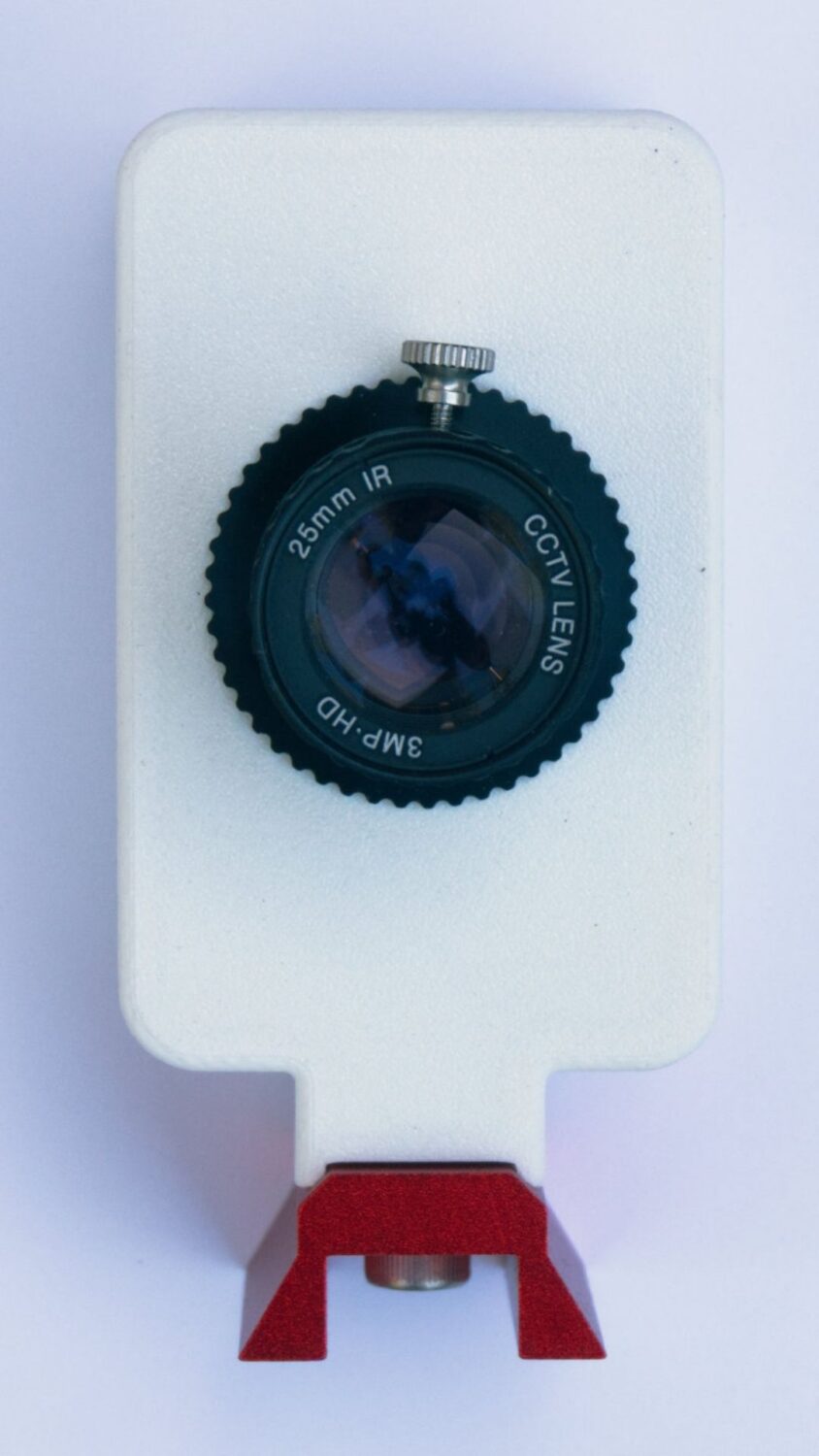 A white Nexus eFinder plate solving device with the camera facing up